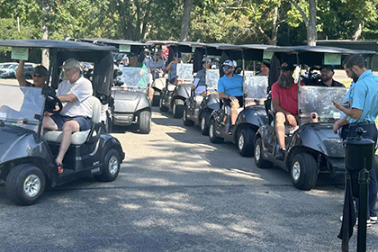 St Monicas Golf Outing - Golf carts on their way to the greens