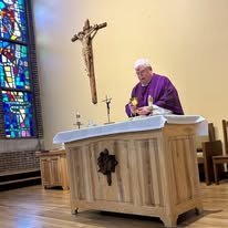 Father presides over Mass at St. Monica's in Racine.