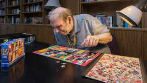 St. Monica's resident building a large puzzle.